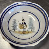 Large earthenware centerpiece dish with painted decoration of a drummer