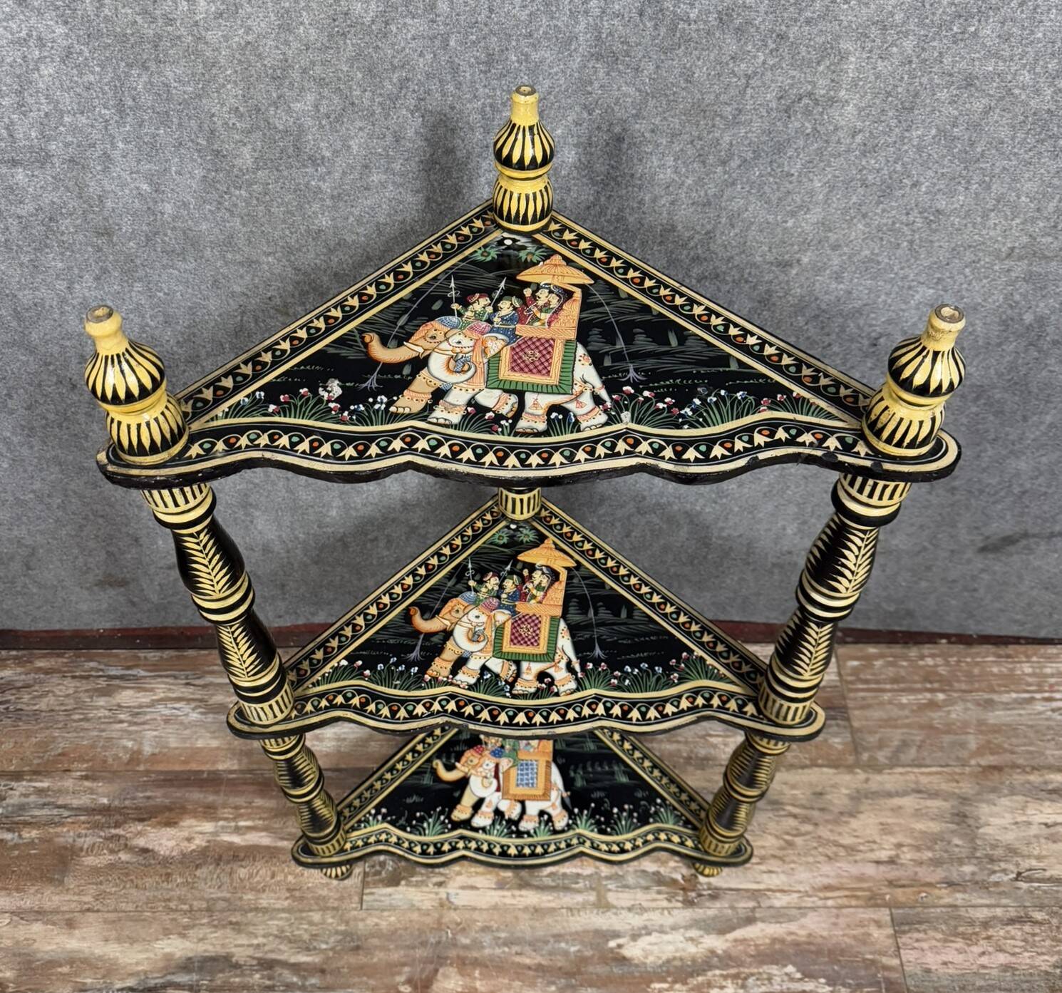 India circa 1900: attractive corner shelf in lacquered and painted wood