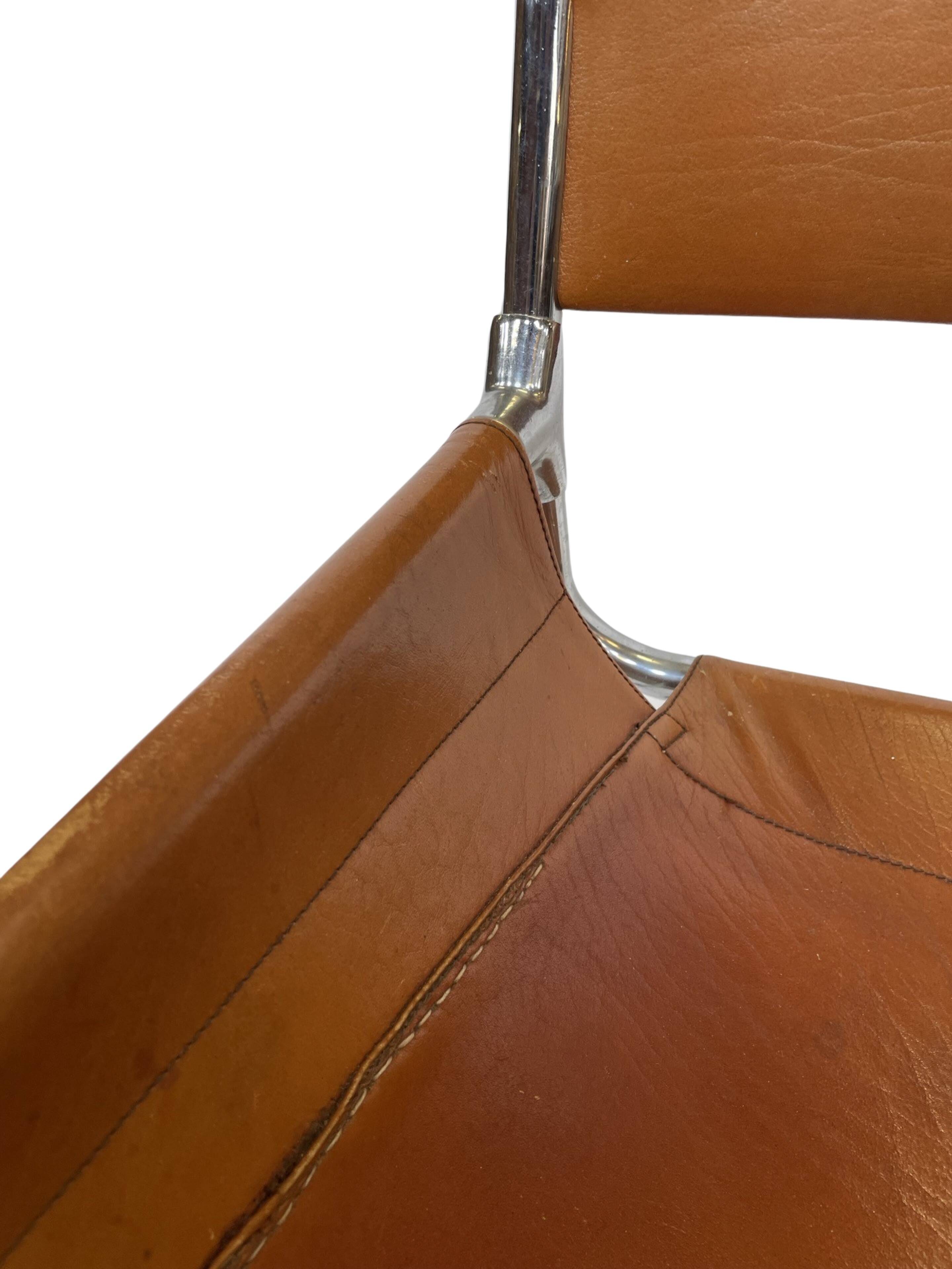 vintage dining room chair in cognac leather and chrome 1970s Italy