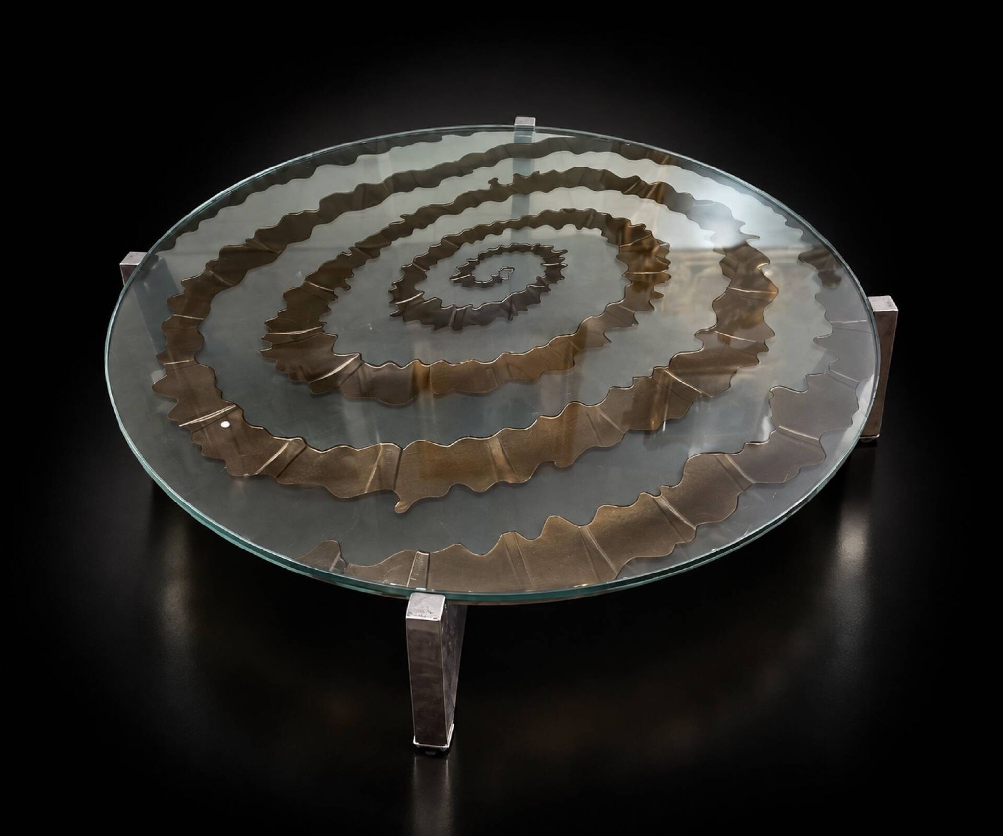 Round coffee table with double glass top, spiral carved decoration.