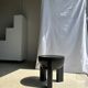 Black mango wood tripod side table with a semi-spherical top, height: 45 cm, diameter: 44 cm.