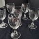 6 vintage wine glasses with baluster stems and engraved decoration on the bowl.