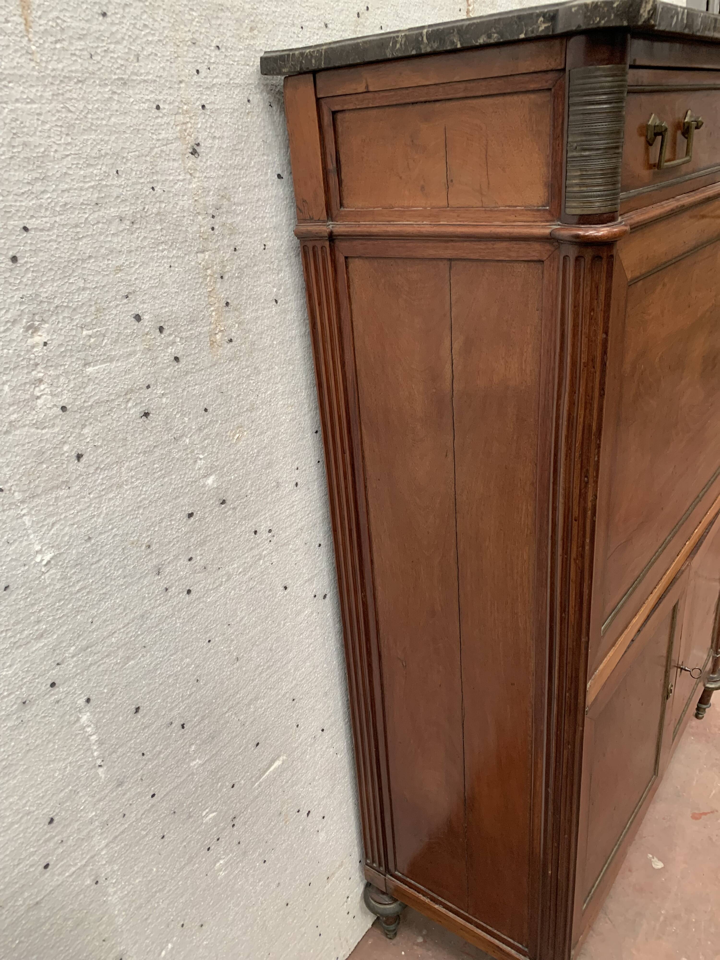 Secretary Louis XVI in mahogany Top of veined gray marble XIX century