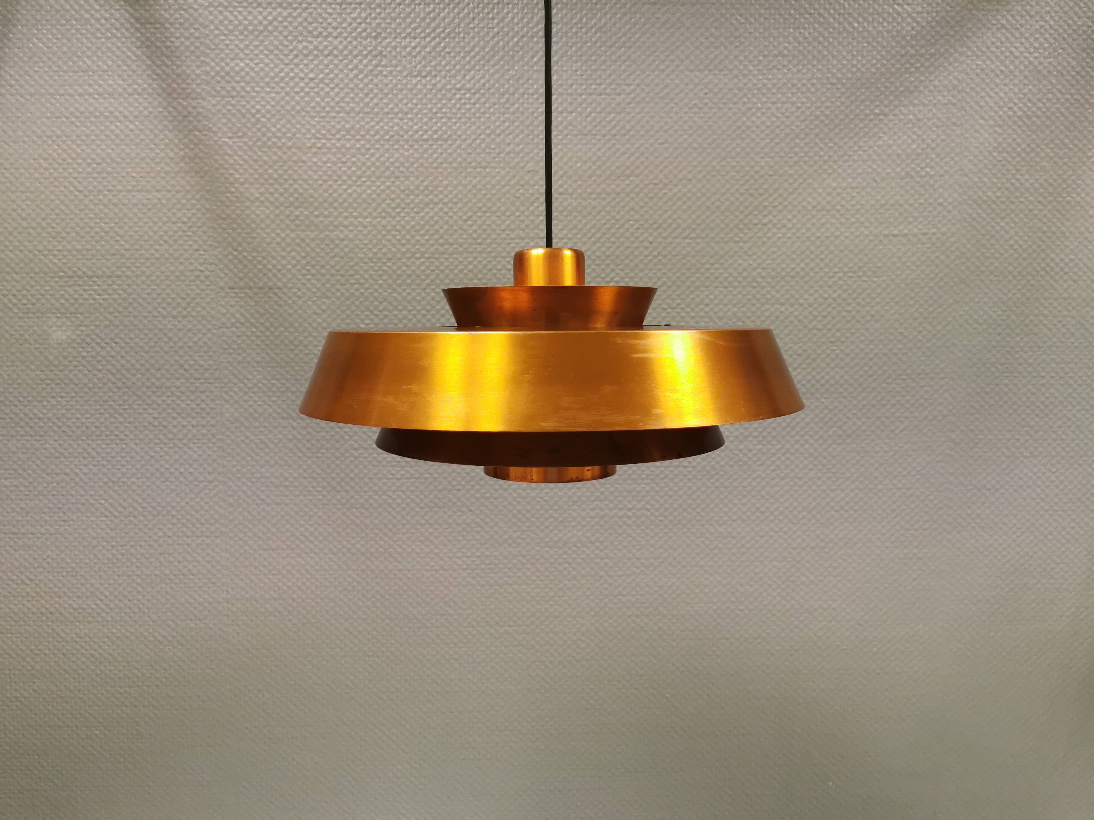 A mid-century Danish hanging lamp in copper by Jo Hammerborg for Fog & Mørup.