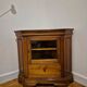 Wooden TV unit with a rotating top.