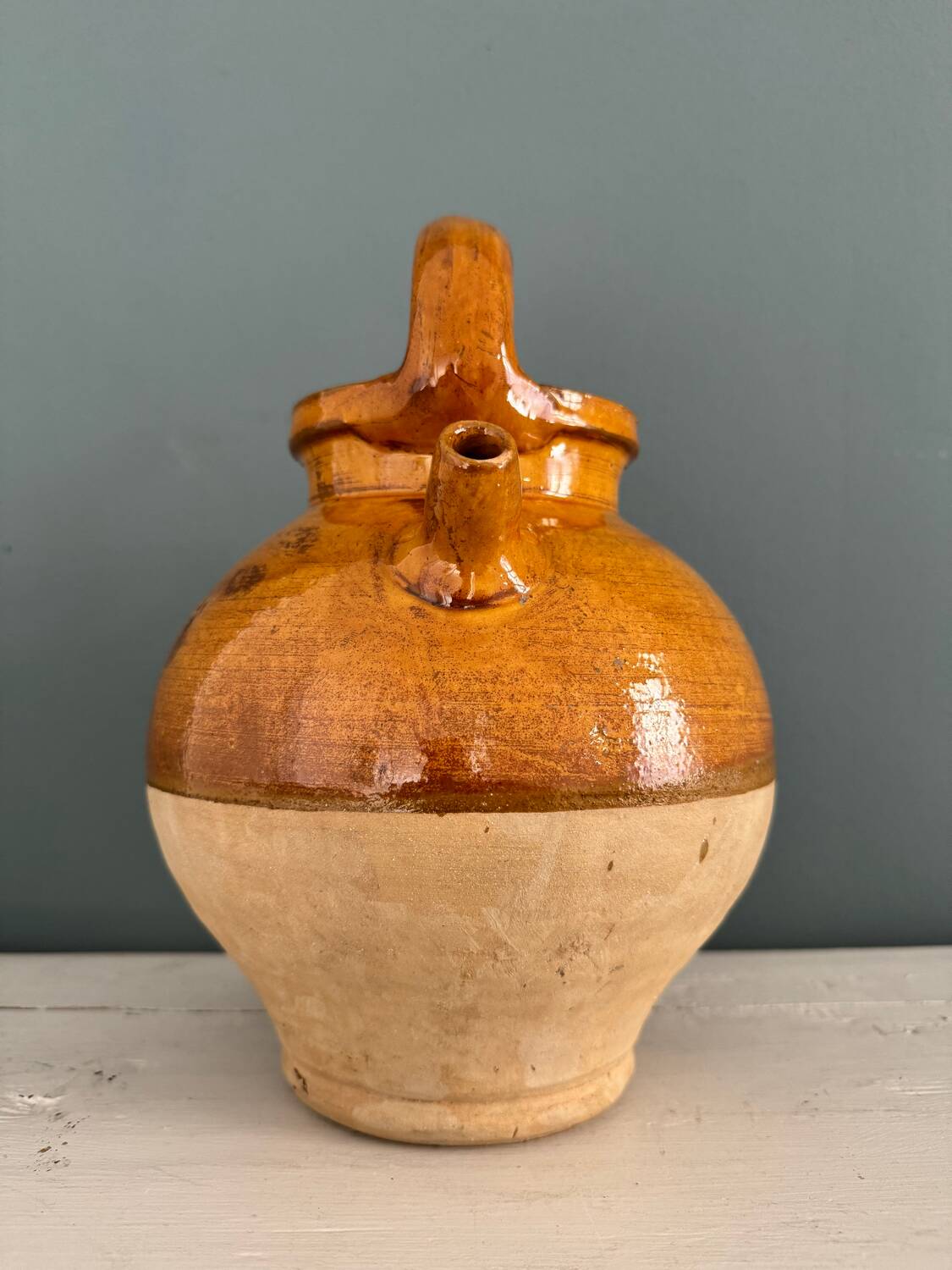 Old terracotta gargoulette jug