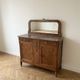 Antique sideboard in burl wood with marble and mirror.