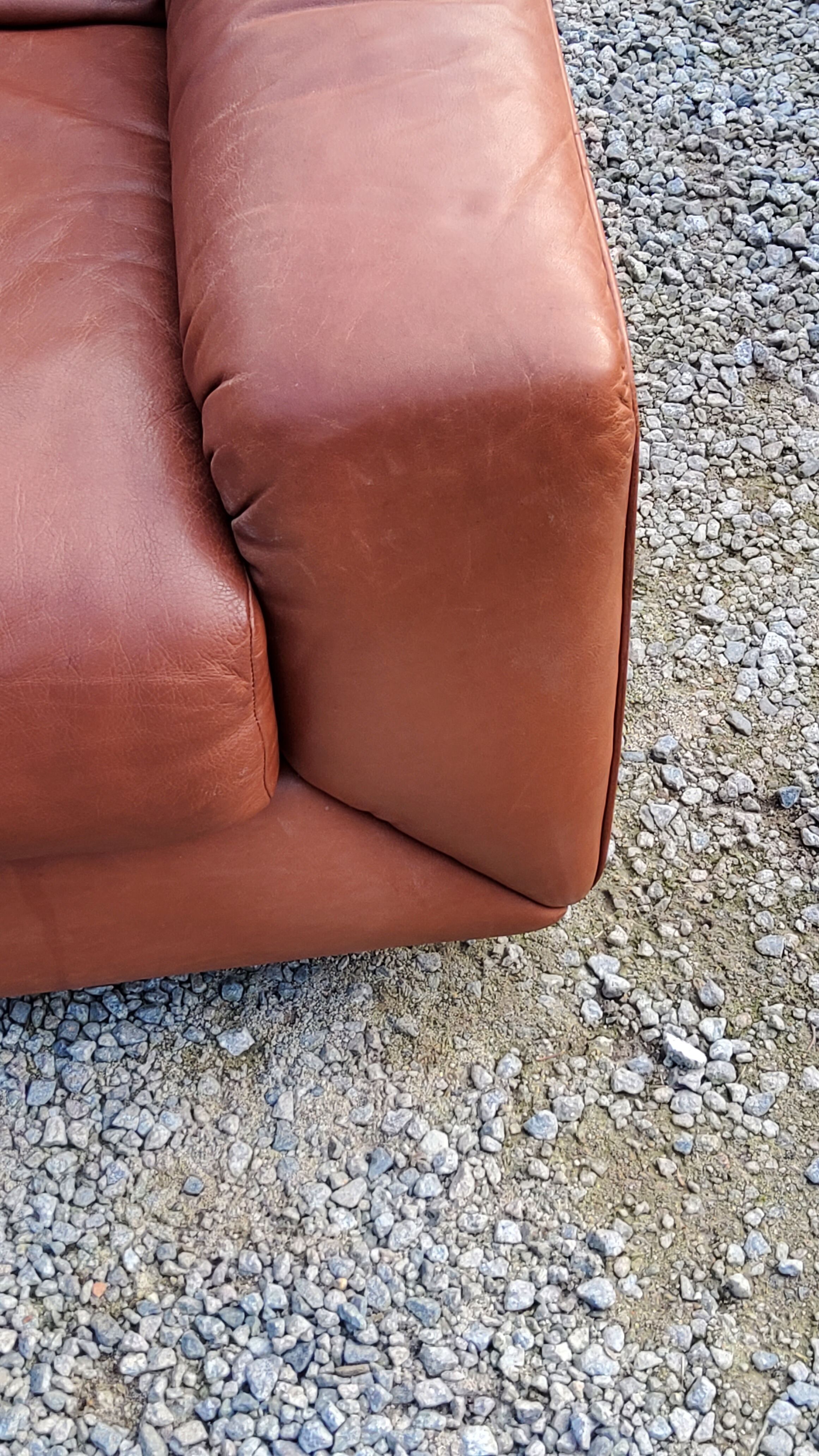 Pair of armchairs and De Sede sofa in cognac leather from the 70s/80s