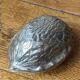 Nutcracker, shaped like a large nut, silver-plated metal