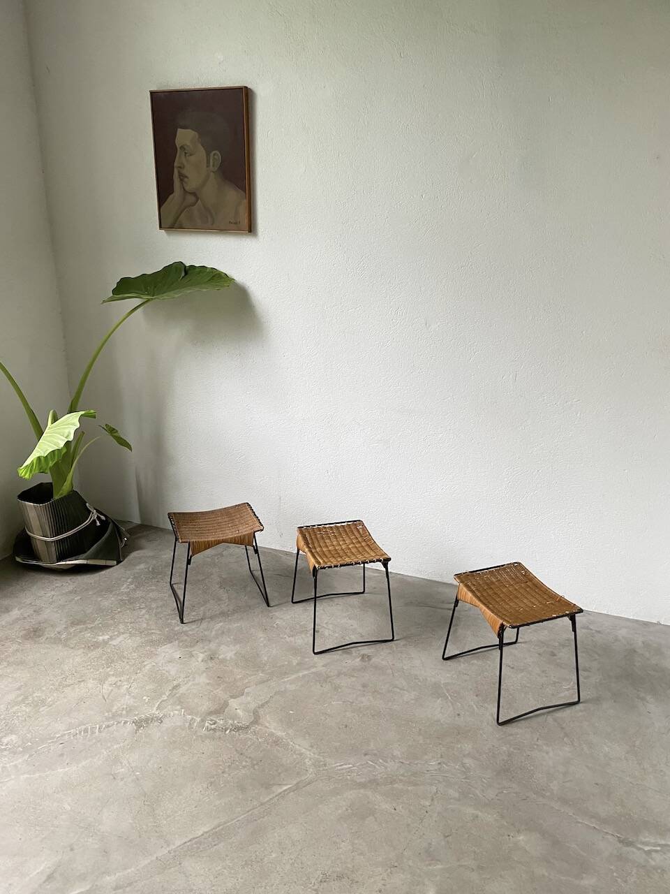 Set of three Raoul Guys wicker and metal stools