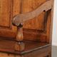 Antique English oak hall bench from the early 19th century with storage space