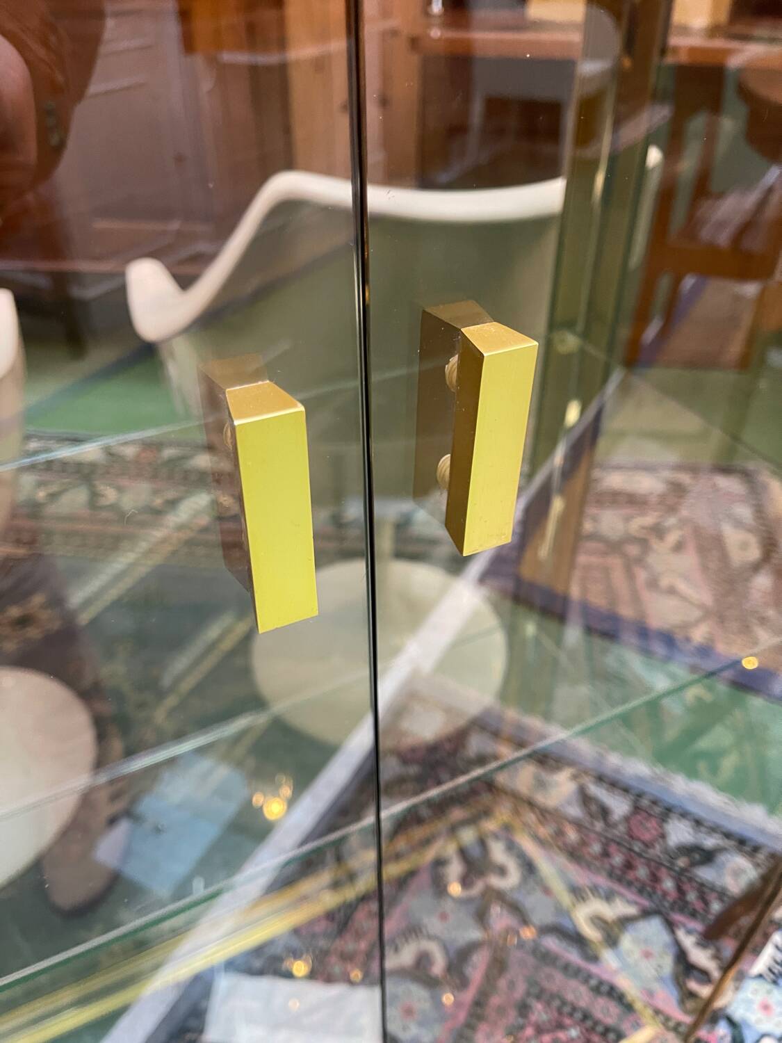 Exhibition showcase in gold-plated chrome and smoked glass - work from the 1980s.