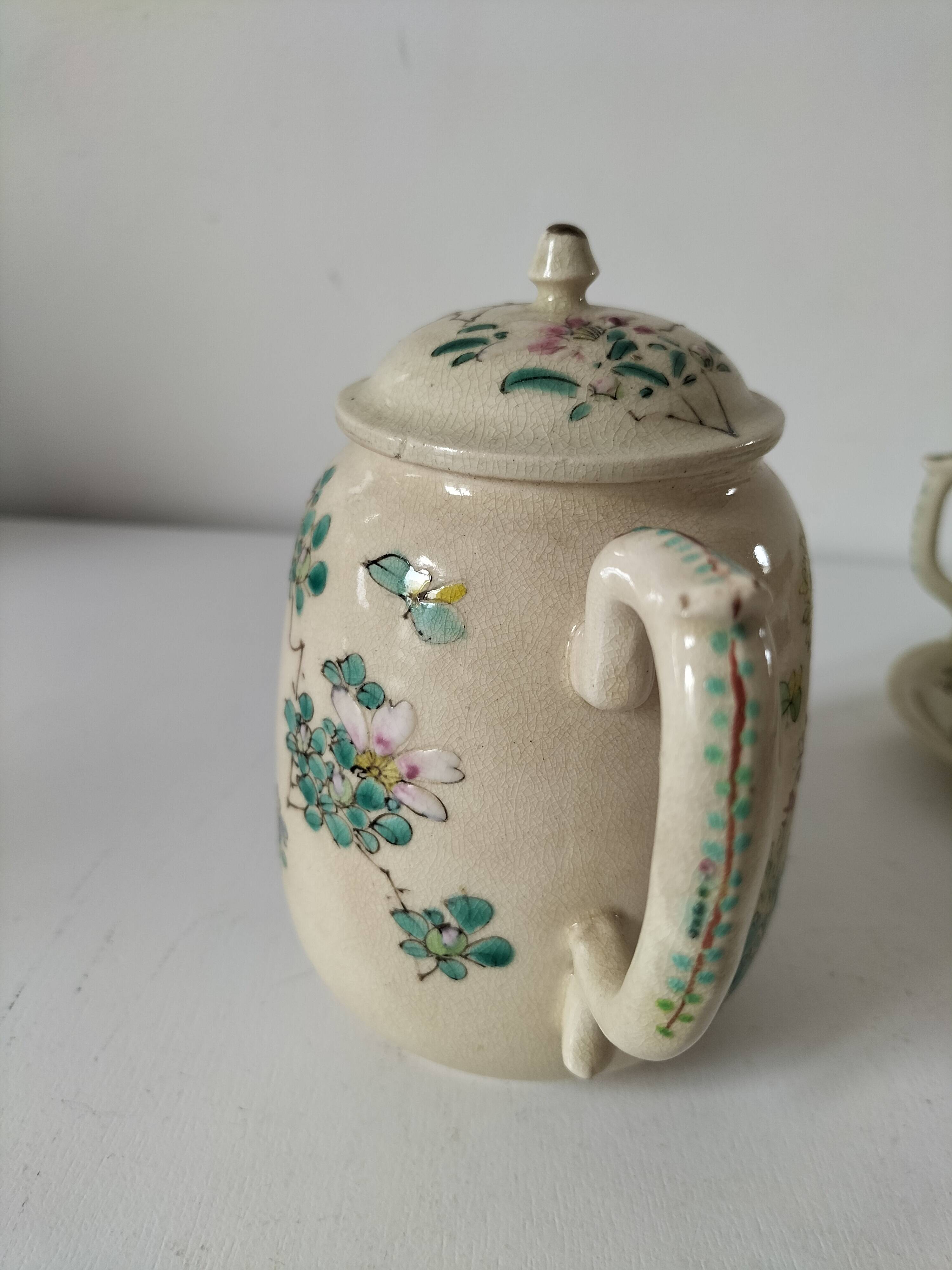 Japanese-style tea set in cracked earthenware with chrysanthemum flowers