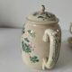 Japanese-style tea set in cracked earthenware with chrysanthemum flowers