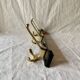 Vintage coat rack in lacquered metal with three golden aluminum hooks