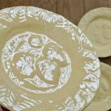 Yellow strawberry slipware plates signed Genevieve Lethu