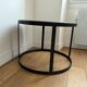 Round coffee table in natural stone and black metal – contemporary design