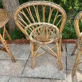 Round table with 2 rattan chairs