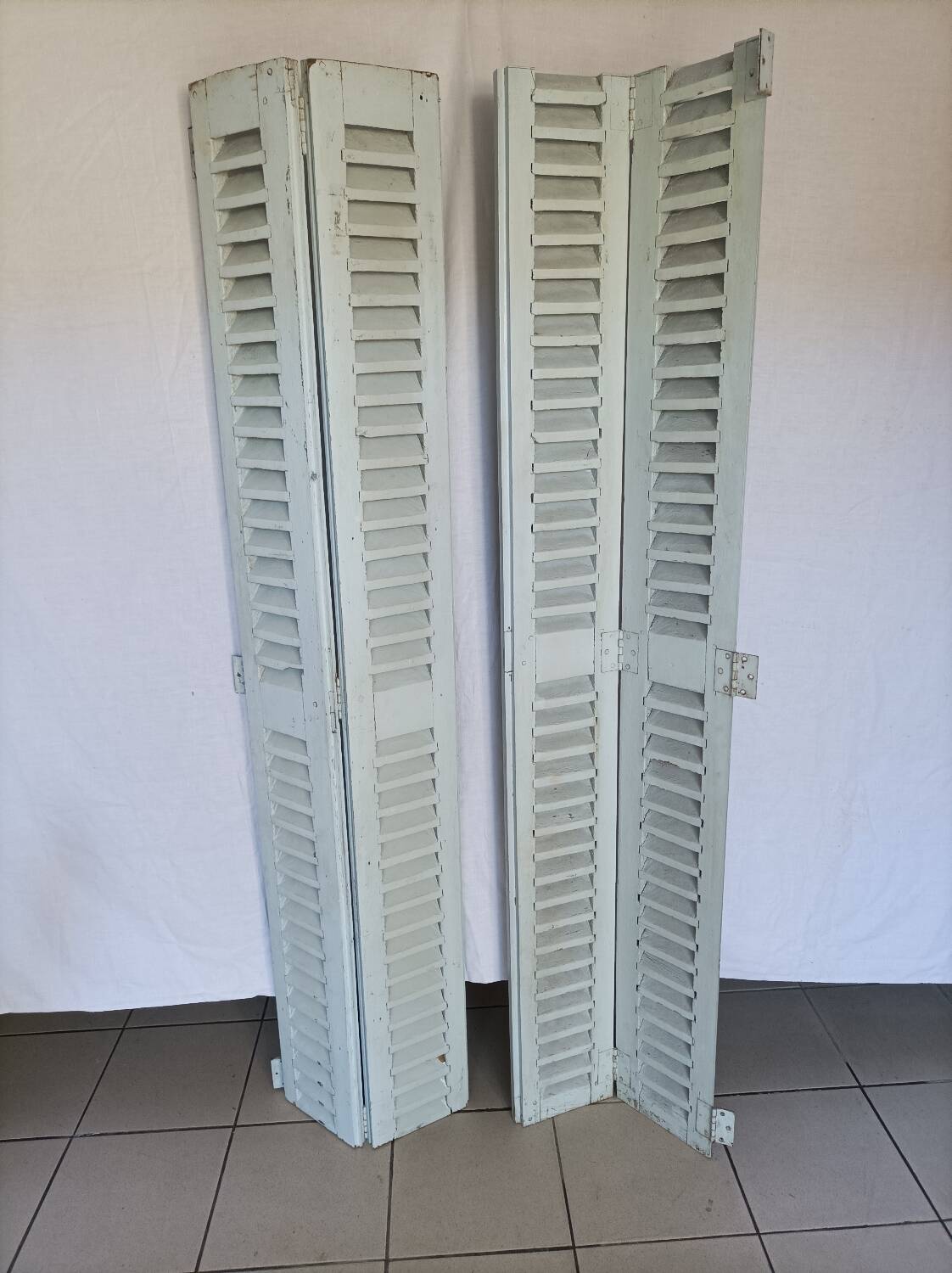 Louvered wooden shutter