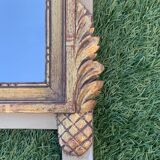 Antique mirror with gilded wood pediment, Louis XVI style