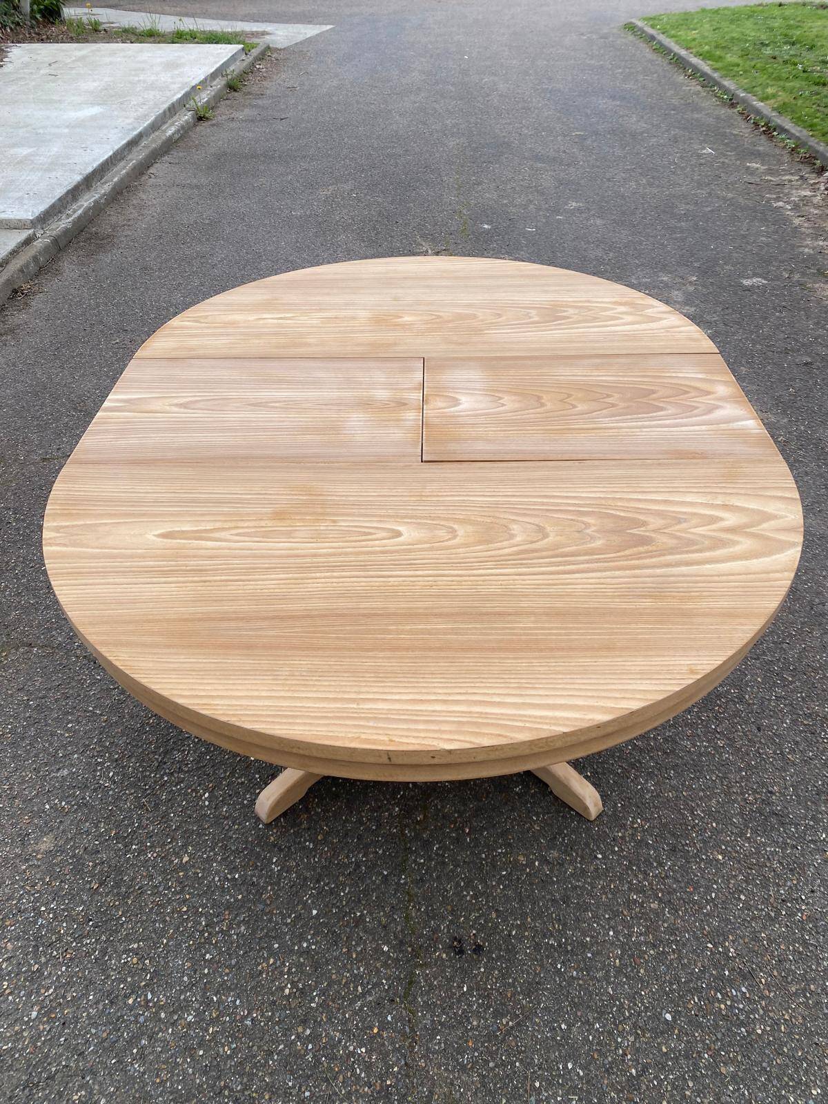 Scandinavian Baumann round extendable dining table with central leg, 115cm.