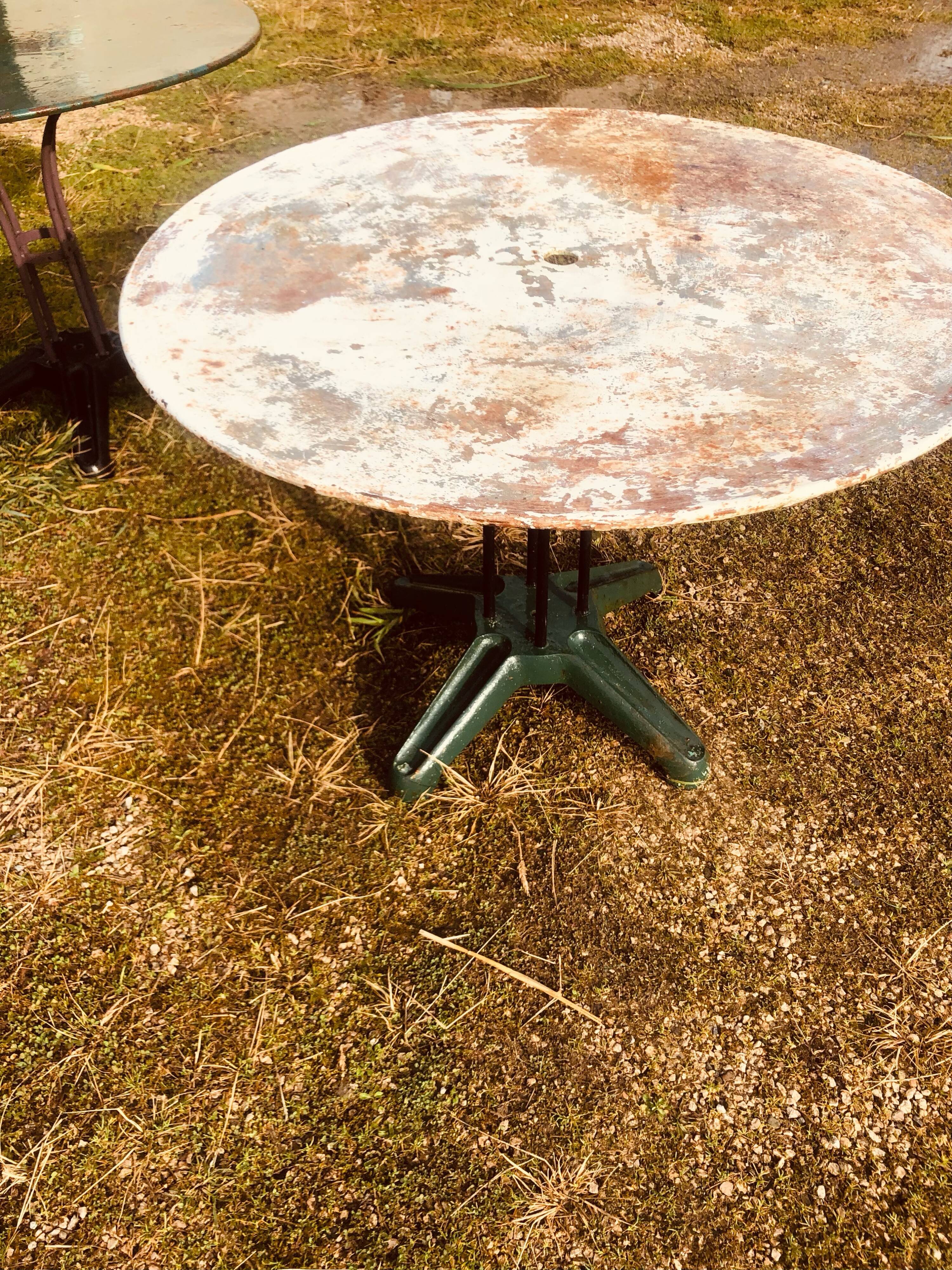 Two metal garden tables make up