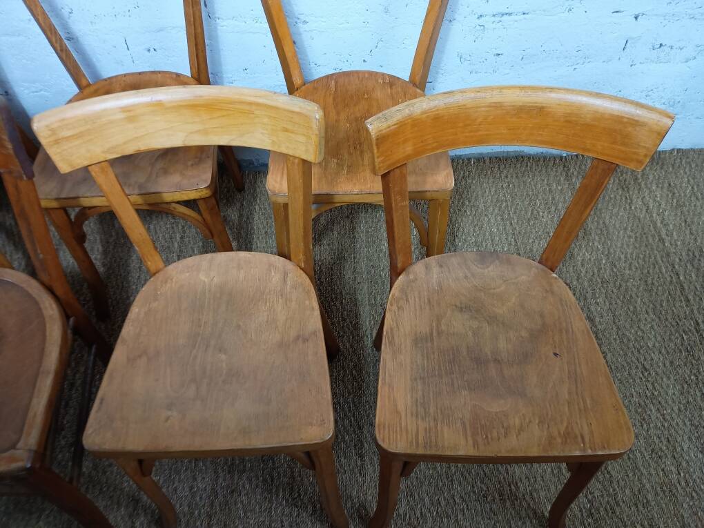 Set of 9 mismatched bistro chairs, 1950s.