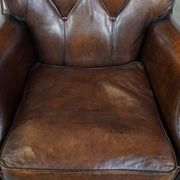 Vintage sheepskin armchair in a dark cognac colour with a comfortable seat