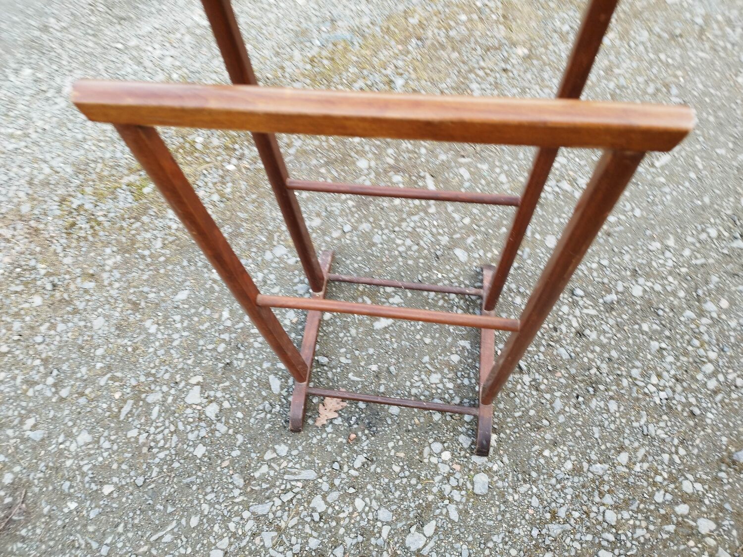 Valet wearing double wood coat rack