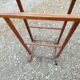 Valet wearing double wood coat rack
