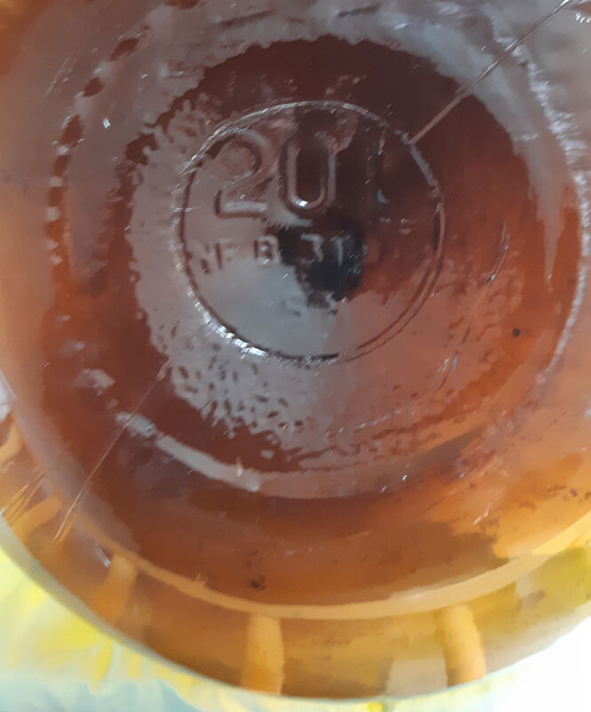 Great old demijohn in amber glass