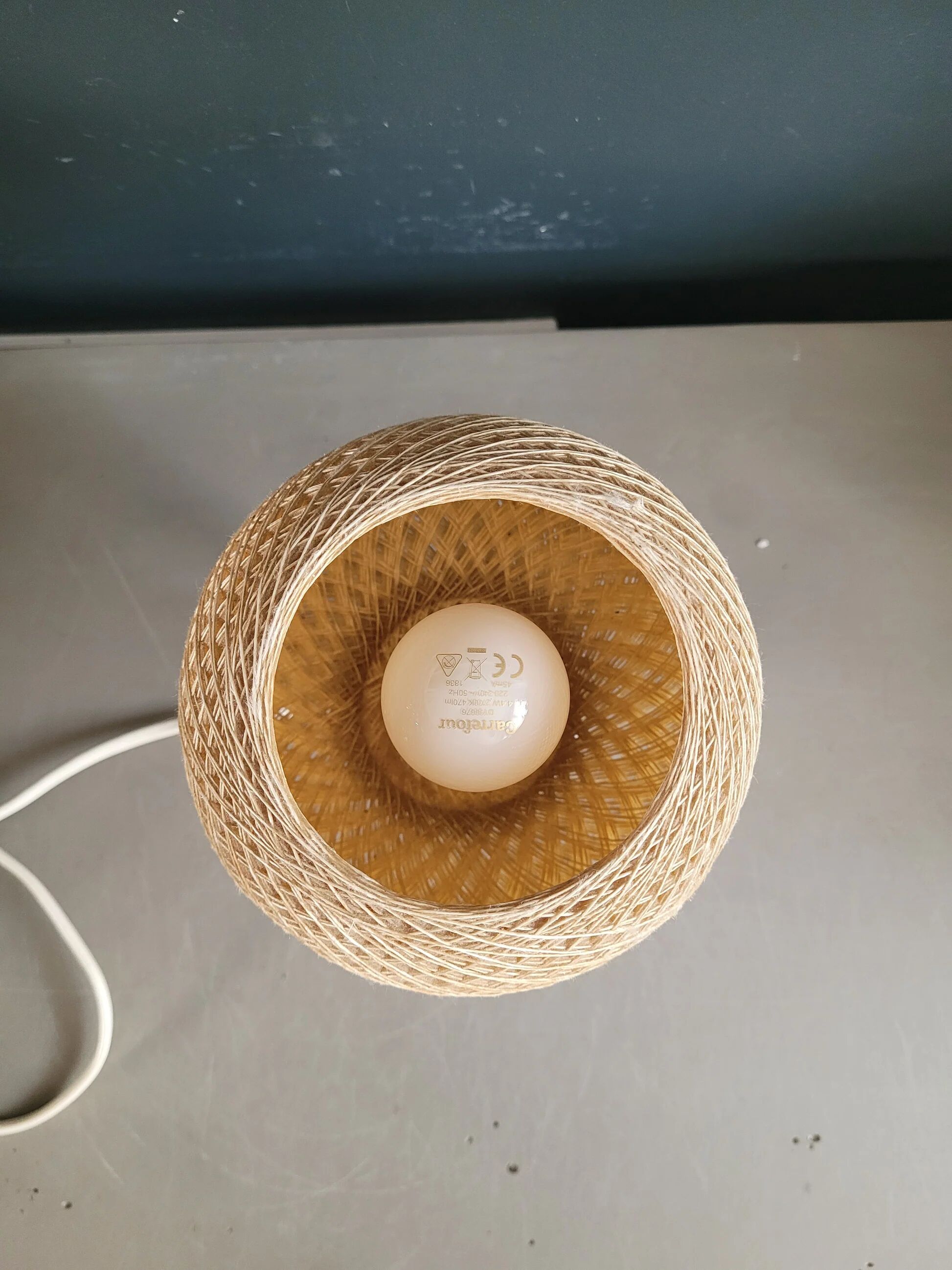 60's table lamp with tulip base and stretched wire shade.