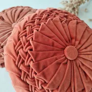 Pleated terracotta red velvet cushion