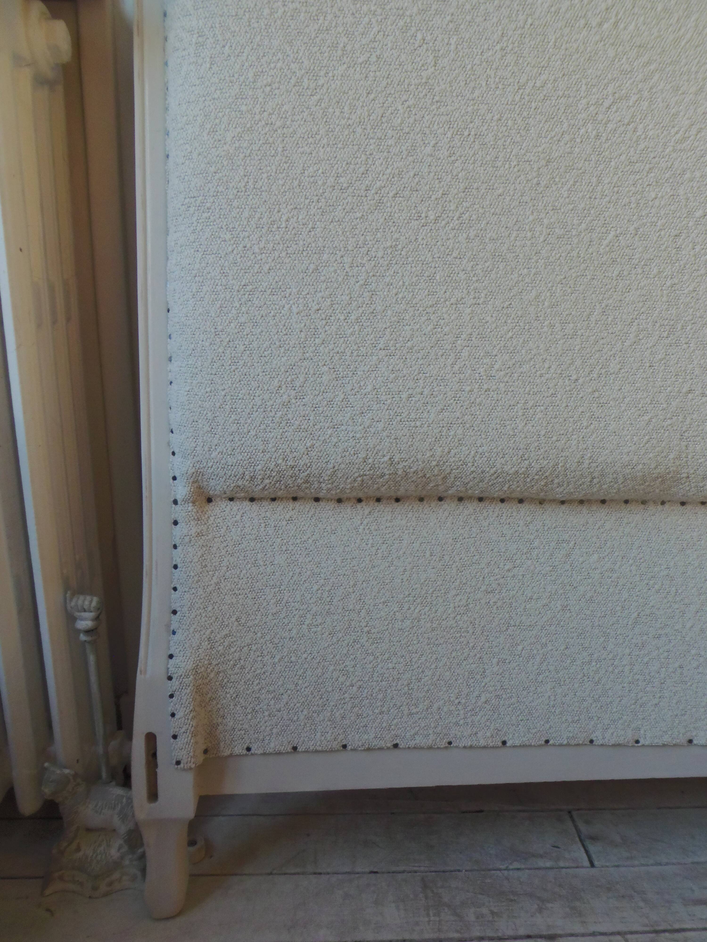 Louis XV style headboard with pearl grey patina, upholstered in off-white bouclette.
