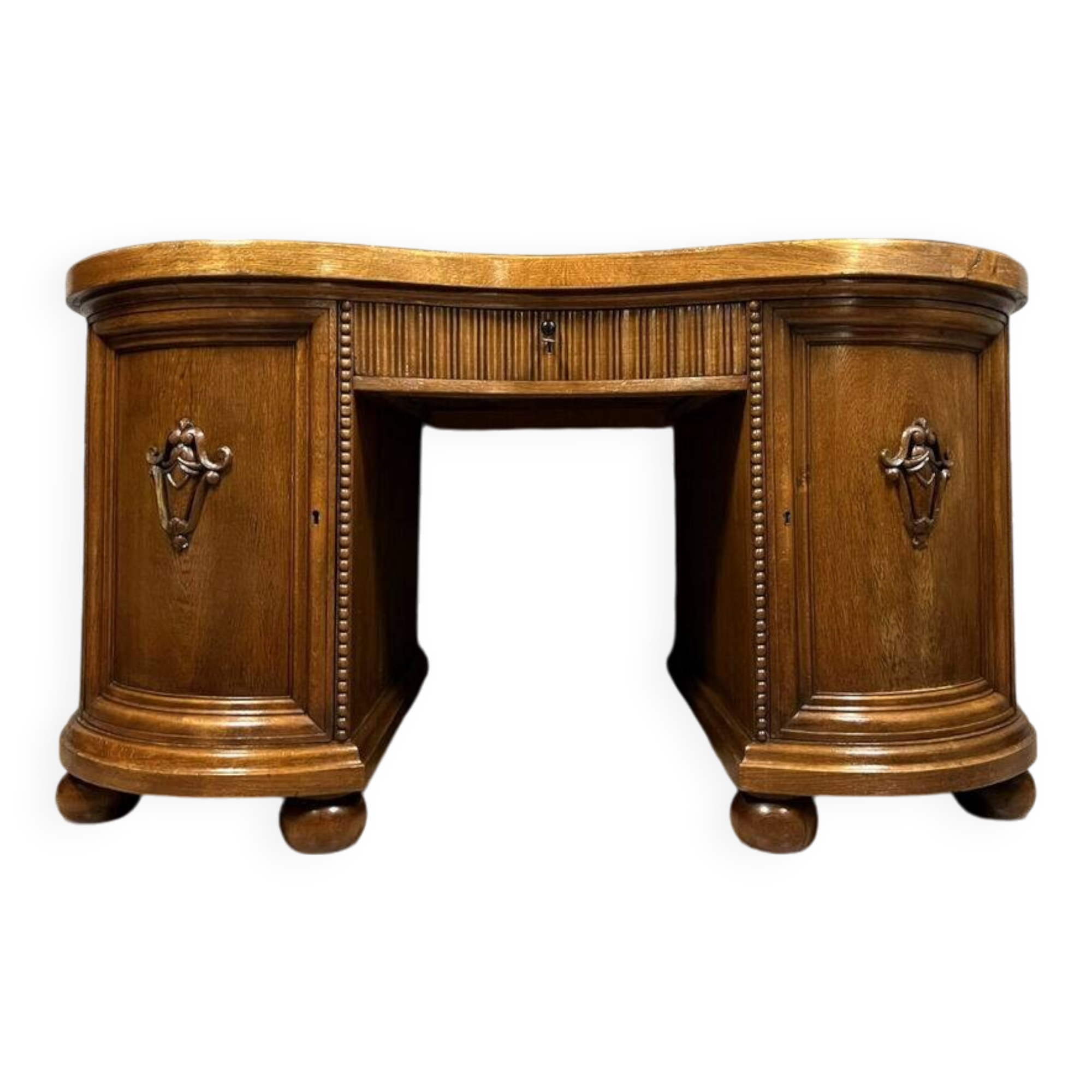 Art Nouveau period bean-shaped oak and walnut center desk