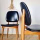 Paire de chaises vintage 1960 – Pieds compas & Simili-cuir noir