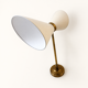 Extendable wall light in the style of Maison Lunel.