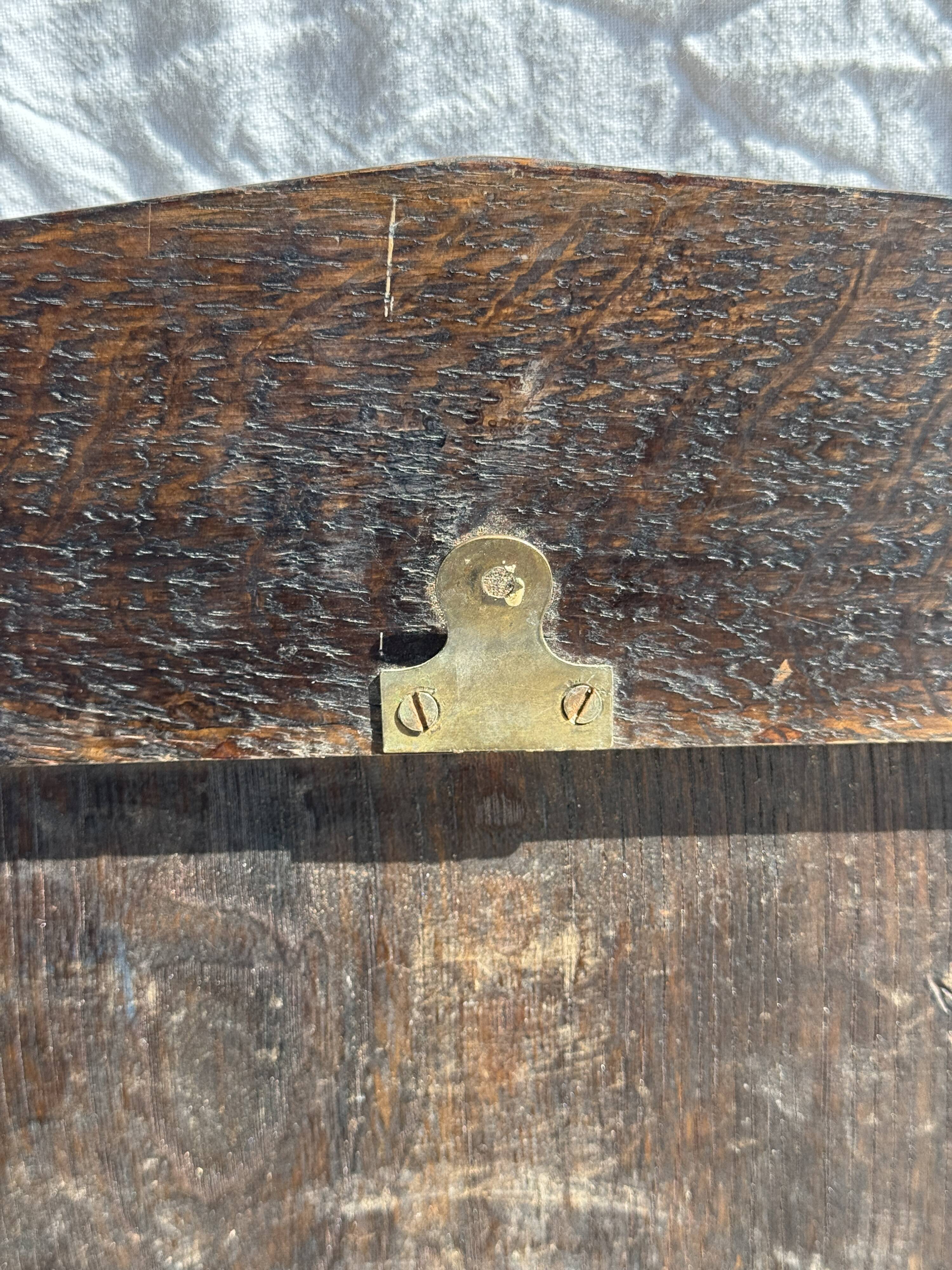 Small antique English rectangular mirror with pediment and oak frame