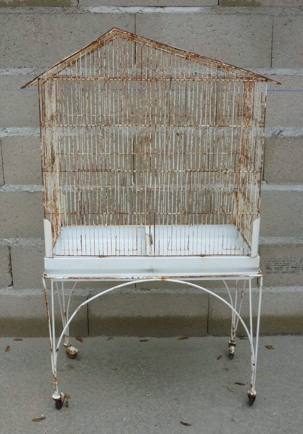 Bird cage with its wheeled holder