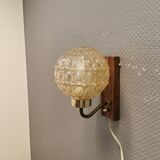 Wall light in rosewood with bobble glass ball shade.