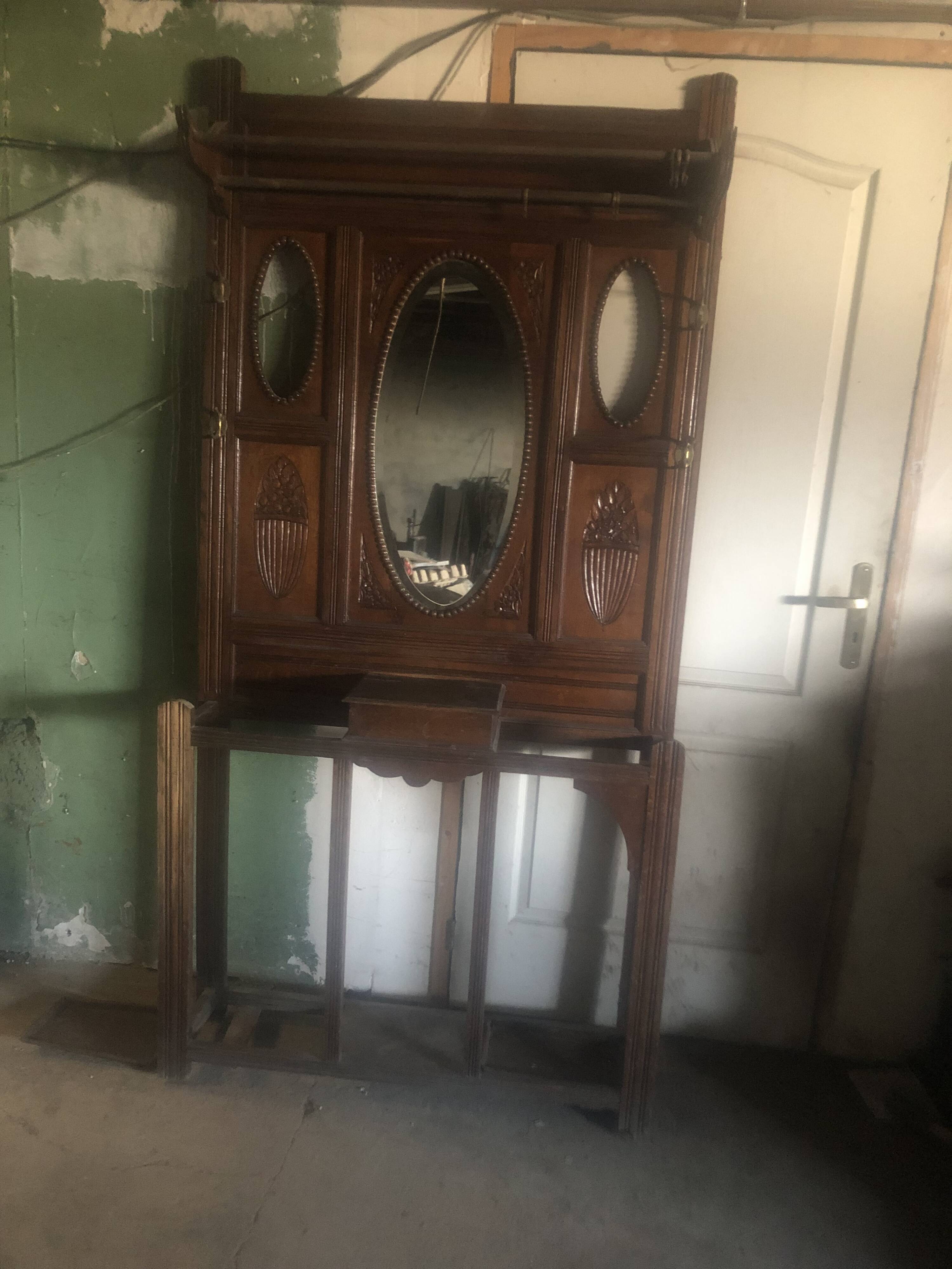 Very decorative coat rack with bevelled mirror.