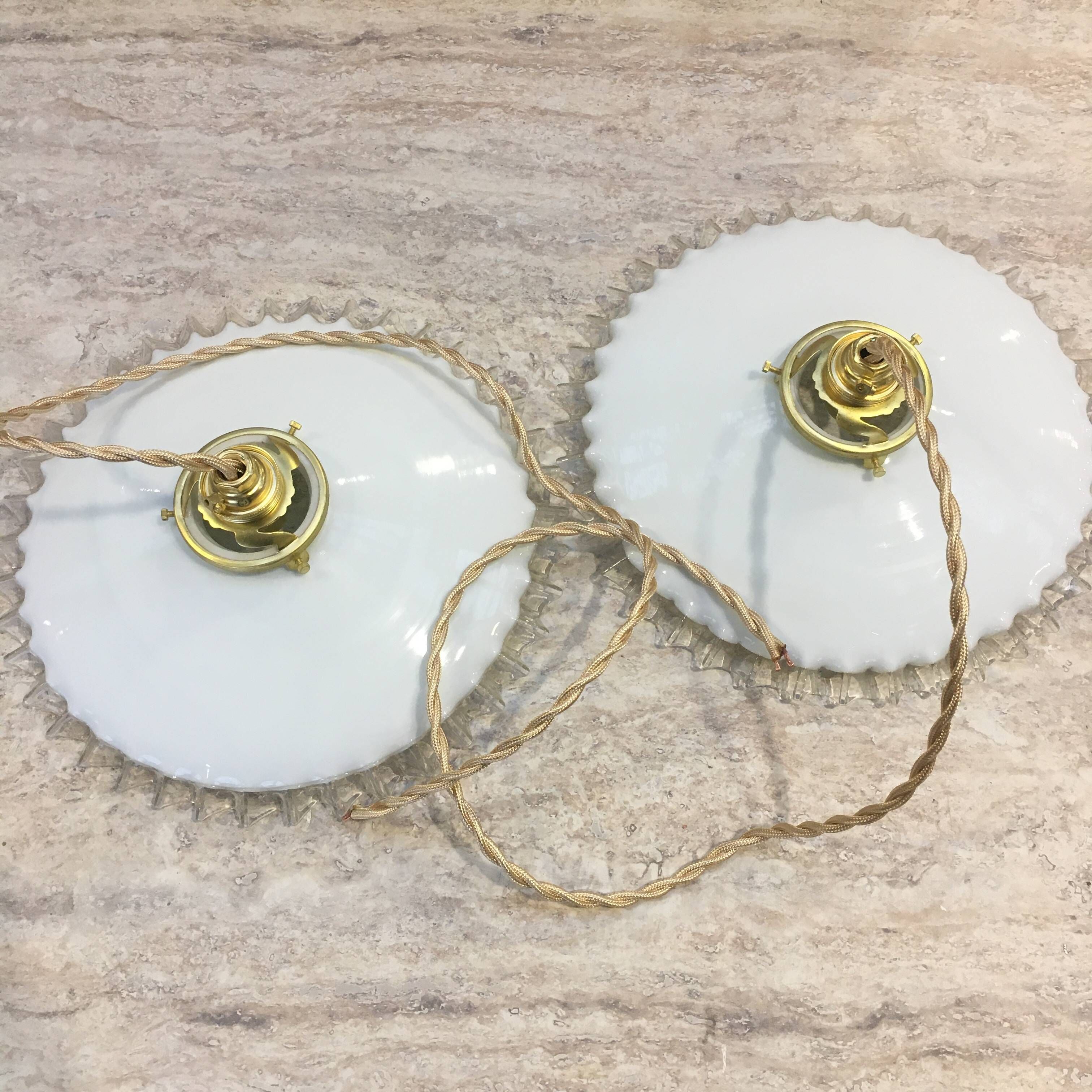 Pair of vintage pendant lights in white opaline and transparent serrated edges