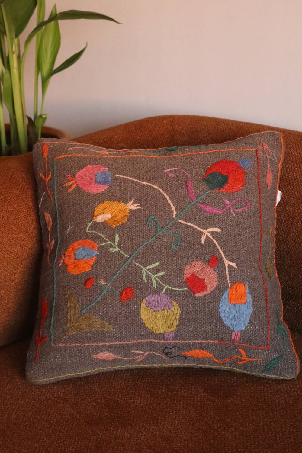 Colorful Suzani cushion in handmade embroidered wool