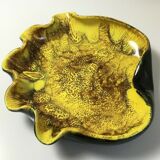 Empty pocket or ceramic ashtray in the shape of a shell