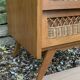 Vintage rattan chest of drawers with splayed legs from the 1950s.