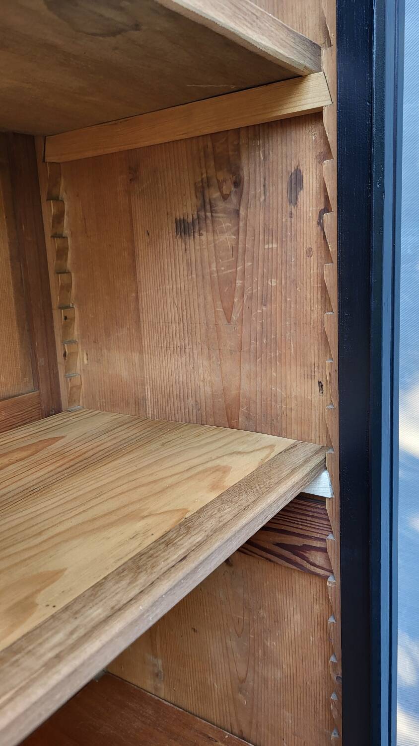 Two-tone black and honey bookcase