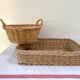 Duo of baskets in braided rattan