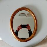 Antique oval mirror in gilded solid wood