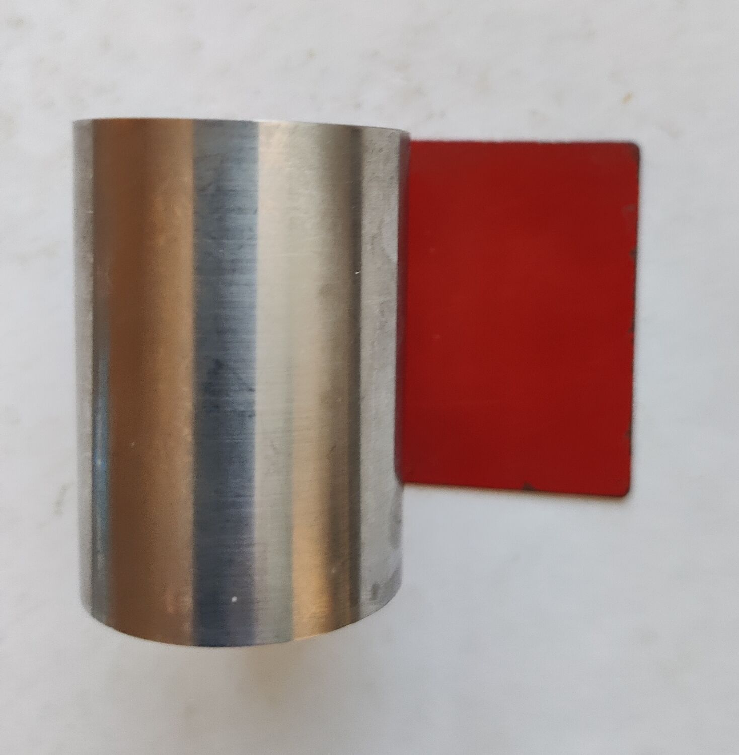 Modernist extendable bookends in brushed stainless steel and red 1970's
