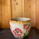 Earthenware cache pot with slip decoration.